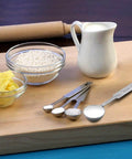 5 Piece Measuring Spoons Set With 1/8 Tsp 1/4 Tsp 1/2 Tsp 1 Tsp And 1 Tbsp Stainless Steel Food Grade Kitchen Spoons displayed on a cutting board