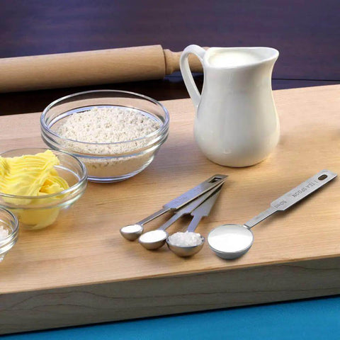5 Piece Measuring Spoons Set With 1/8 Tsp 1/4 Tsp 1/2 Tsp 1 Tsp And 1 Tbsp Stainless Steel Food Grade Kitchen Spoons displayed on a cutting board