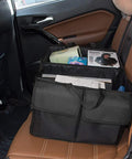 Car Trunk Backseat Organizer For SUV Eight Pocket Waterproof And Dustproof Cargo Net Storage with books and magazines inside.