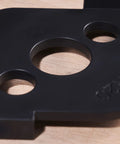 Close-up of Radius Jig Router Templates 4 Pack With 8 Radius Sizes For Woodworking in black ABS, showing circular openings.