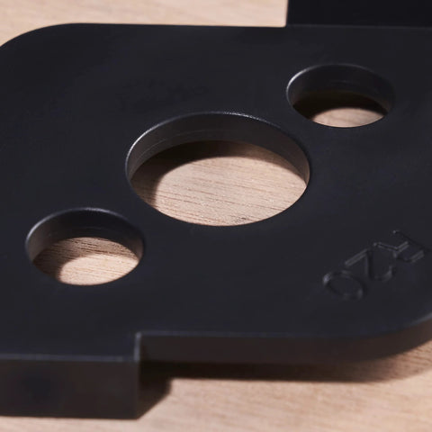 Close-up of Radius Jig Router Templates 4 Pack With 8 Radius Sizes For Woodworking in black ABS, showing circular openings.