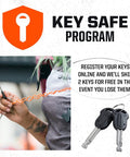 Person holding orange key coil next to Mini U Lock With 4 Ft Security Cable, 7mm Hardened Steel Shackle, Double Deadbolt Locking keys
