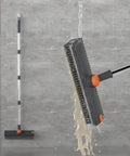3 In 1 Floor Scrub Brush With Long Adjustable Handle Heavy Duty Stiff Bristles And 90 Degree Design Squeegee And Tweezer For Cleaning Bathrooms Kitchens Garages Tiles Decks And Patios Gray shown in use with water cleaning a bathroom floor