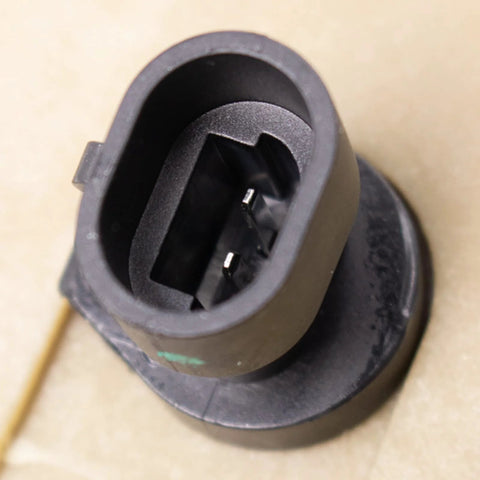 Brake master cylinder for International 4700 with hydraulic booster; black plastic round port, close-up view