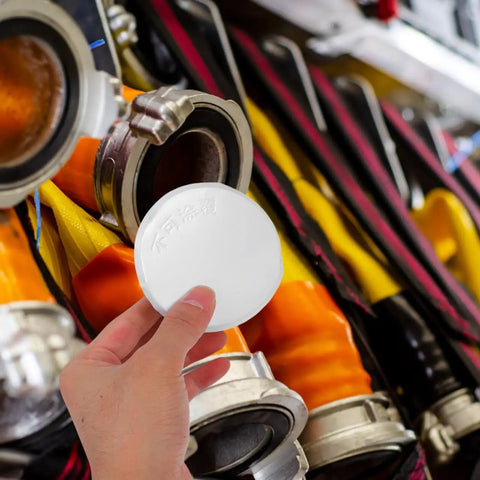 Sleek Iron Fire Sprinkler Nozzle Cover Plate With Tough Head Protector And Snug Ceiling Escutcheon to mask holes, held in hand.