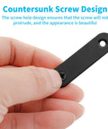 Hand holding 20 Sets Black Stainless Steel Flat Plate Straight Brackets For Wood 2 Inch 50x16x2 Mm with countersunk screws