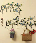 Wall Mounted Coat Rack With Seven Sturdy Hooks Entryway Organizer For Jackets Keys And Bags Zero Hassle Install And Sleek Finish with decorative butterflies and plants.