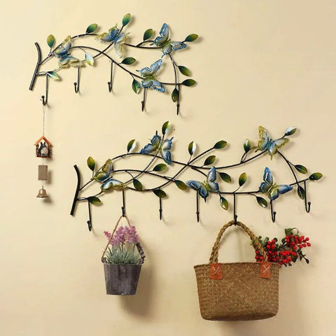 Wall Mounted Coat Rack With Seven Sturdy Hooks Entryway Organizer For Jackets Keys And Bags Zero Hassle Install And Sleek Finish with decorative butterflies and plants.
