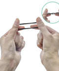 Front view of hands stretching two black Buna-N 70A O-rings, part of a metric O-ring kit