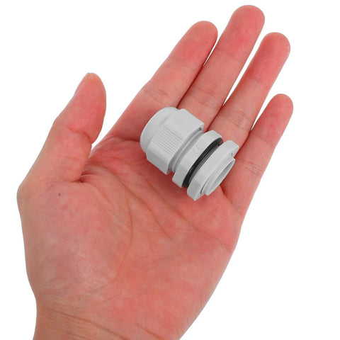 Heavy Duty Nylon Cable Gland Connectors 25 Piece Pack in hand, showcasing adjustable grip and waterproof design fitting 3 to 15 mm cable.