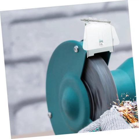 Clear Eye Protection Shield For Bench Grinder With Transparent Dust Guard Plate Durable Safety Shield Easy To Install Replacement Part For Grinding Machine Fits Most Table Grinders on a blue bench grinder with sparks.