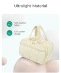Lightweight Puffy Travel Toiletry Bag For Women With Handle Must Have Large Cosmetic Organizer Beige with soft quilted fabric.