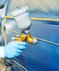 Person using spray gun with Pro Grade Fineline Pinstripe Tape Set With Four Widths One Sixteenth Inch One Eighth Inch One Quarter Inch And One Half Inch And Sixty Yard Length For DIY Car Paint Art Masking Tape That Stays Put And Delivers Clean Lines For Sharp Auto Finishes on car
