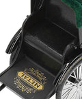 Close-up of Retro Alloy Rickshaw Model Miniature Decor showcasing legit vintage charm with detailed black seating.