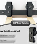 Close-up of Four Door Bi-Fold Sliding Barn Door Hardware Kit in Rustic Black showing top mount folding roller system with nylon wheels.