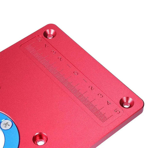 Premium Universal Aluminum Router Table Insert Plate With Heavy Gauge Ring For Kick Butt Performance And No Fuss Setup Works Flawlessly With Standard Drill Chucks 235X120X8Mm close-up showing red color and measurement scale.