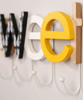 Rustic Wall Mounted Coat Hooks Solid Pine Wood Distressed Finish Super Tough Heavy Duty Multi Hook Rack For Coats Hats Keys close up detail of colorful letters with hooks