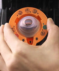 Person using 2.0 Needle Cleaning Tool For Keurig 2.0 Brewers Maintenance Accessory For Clearing Needle Block No Fuss Flush Dried Coffee Debris Compatible Only With Keurig 2.0 Brand New In Box Orange Color