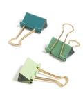 Three green and teal binder clips from the Succulent Garden Office Accessory Kit With Sticky Note Pad, Gold Paper Clips, Sphere Push Pins, Succulent Magnets And Binder Clips To Elevate Your Desk Setup, Boost Productivity And Flaunt Your Desk Vibe.