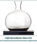 Hella Smooth Top Shelf Cold Drip Coffee Machine And Handmade Glass Cold Brew Tower With Adjustable Dripper And Premium Wood Stand. Round borosilicate glass pot with a sleek design.