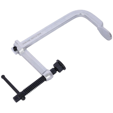 Heavy Duty F Clamp With Removable Swivel Pads And Deep 8 Inch Jaw For Serious Welding And Woodworking Projects That Need Real Grit And Grip To Hold Things Tight, showing metal construction.