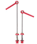 Red titanium alloy quick release skewer levers for mountain and road bikes, ultra lightweight wheel fastener with movable handle and twist lock.