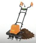 Beast Corded Garden Tiller Cultivator With Foldable Handle 14 Inch 12 Amp Motor Four Steel Tines next to turned soil
