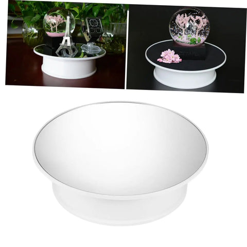 MiniKEYA Electric Rotating Display Stand USB Powered Turntable With Sturdy Base Non-slip Mirrored Surface showcasing items on a table.