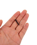 Hand holding a screw from the 450 Piece Carbon Steel Self Tapping Screw Kit With Cross Head For Small Electronics And Home DIY Repairs.