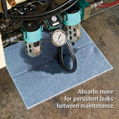 Blue Absorbent Mat Pad In Dispenser Box Heavy Duty Pack Of Fifty With 75 Percent Recycled Fibers Fire Retardant in use under machinery
