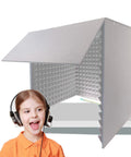 Top Shelf Sound Proof Foam Panels Portable Soundproof Booth with a smiling child using a headset for vocal recordings.