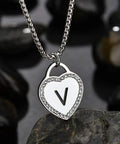 Womens Silver Initial Necklace With Heart Pendant Stainless Steel Customizable Name Jewelry For Girlfriend Alphabet Letter V Gift For Her Romantic Sweet Keepsake on black stones background