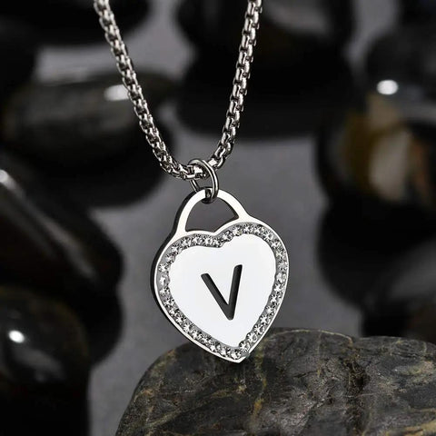 Womens Silver Initial Necklace With Heart Pendant Stainless Steel Customizable Name Jewelry For Girlfriend Alphabet Letter V Gift For Her Romantic Sweet Keepsake on black stones background