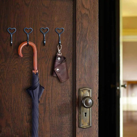 Four Pack Cast Iron Heart Wall Hooks Black Heavy Duty Hook For Keys Belts Towels Super Sturdy Rust Proof Finish holding umbrella and keychain.