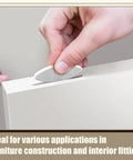 Inserting 50 White PVC Biscuit Joiner Connectors Kit With Self Clamping Plates For DIY Woodworking And Decks, 20mm Size into slot.