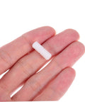 100 Pcs Nylon Hidden Fasteners And Double Headed Furniture Connectors To Keep Shelves And Cabinets Locked Down Tight With A Smooth Clean Look Heavy Duty Workshop Gear For Reliable Diy Build, white fastener held between fingers.