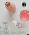 10 Pack Sublimation Blanks Keychains Aluminum Bottle Opener Transfer Key Rings For Custom DIY Gifts And Dope Crafts on table