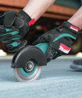 Hands using Four And A Half Inch Angle Grinder With Seven Point Five Amp Motor Delivers Eleven Thousand RPM AC DC Switch on concrete