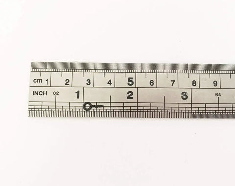 Black Tiny Screw Eye Pin next to a ruler for scale, measuring 10x4 mm, used in jewelry making and craft projects, durable and rust resistant.