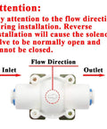Image of 12 Volt DC Water Solenoid Valve One Quarter Inch Inlet Normally Closed For RO Reverse Osmosis Systems with flow direction guide.