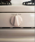 Thermostat Oven Knob Replacement For GE And Hotpoint Range Ovens showing white control knob on oven front view