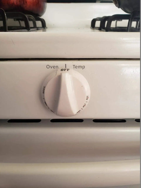 Thermostat Oven Knob Replacement For GE And Hotpoint Range Ovens showing white control knob on oven front view