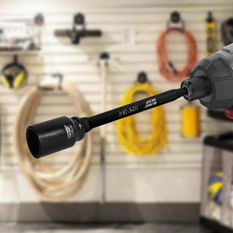 6 Piece Beefy Heavy Duty Impact Socket Adapter Set For Drill And Impact Wrench With 3 Inch And 6 Inch Hex Shank Extensions One Quarter Inch Three Eighths Inch One Half Inch Drive Adapters Holder Included in use, attached to a drill in a workshop.