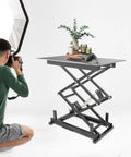 Heavy Duty Electric Scissor Lift Table With Remote Control For Raising Heavy Loads Up To 180 Lbs in use for product photography.
