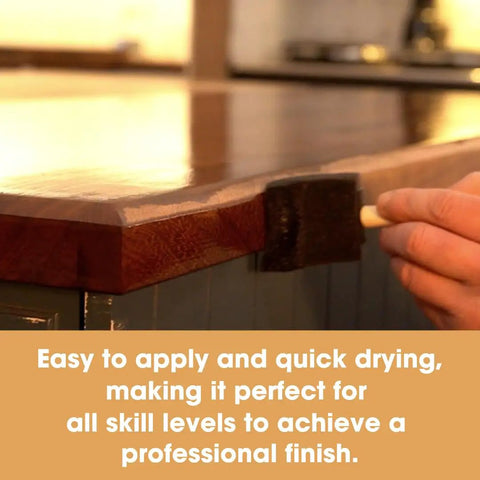 Applying Heavy Hitter Danish Oil Wood Sealer on a wooden countertop for a satin finish and protection against water rings.