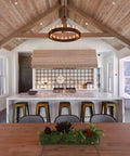 Legit Reactive Water Based Wood Stain With A Slick Reclaimed Vibe Weathered Tan Tones Hit Different On Any Surface Voc Free Solid Formula For Interior Or Exterior Jobs In 55 Gallon Drum used in a modern kitchen with wood beams and a marble island.
