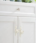 Euro Rose Cabinet Knobs With Backplates 2 Pack Vintage Zinc Alloy Handles on white dresser with gold edges installed