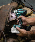 Using 18V LXT Brushless Cordless Three Eighths Inch Drive Impact Wrench With Friction Ring Anvil on machinery