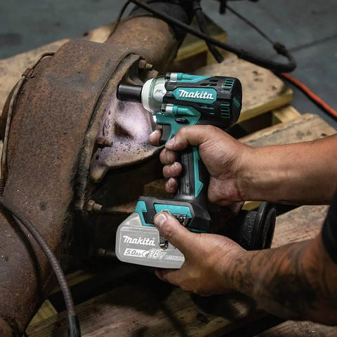 Using 18V LXT Brushless Cordless Three Eighths Inch Drive Impact Wrench With Friction Ring Anvil on machinery