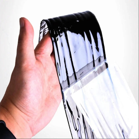 Heavy Duty Self Adhesive Roofing Tape For Fixing Shingles And Rv Leaks Pro Grade Waterproof Bitumen Underlayment Roll held in hand.